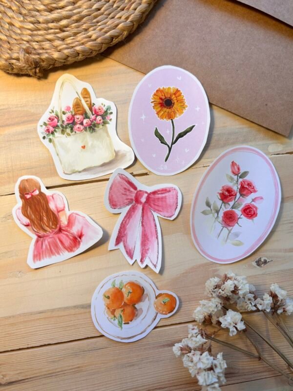 six various watercolour stickers on the table