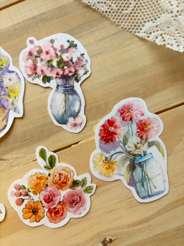 three blooming vases stickers on the light brown wooden table